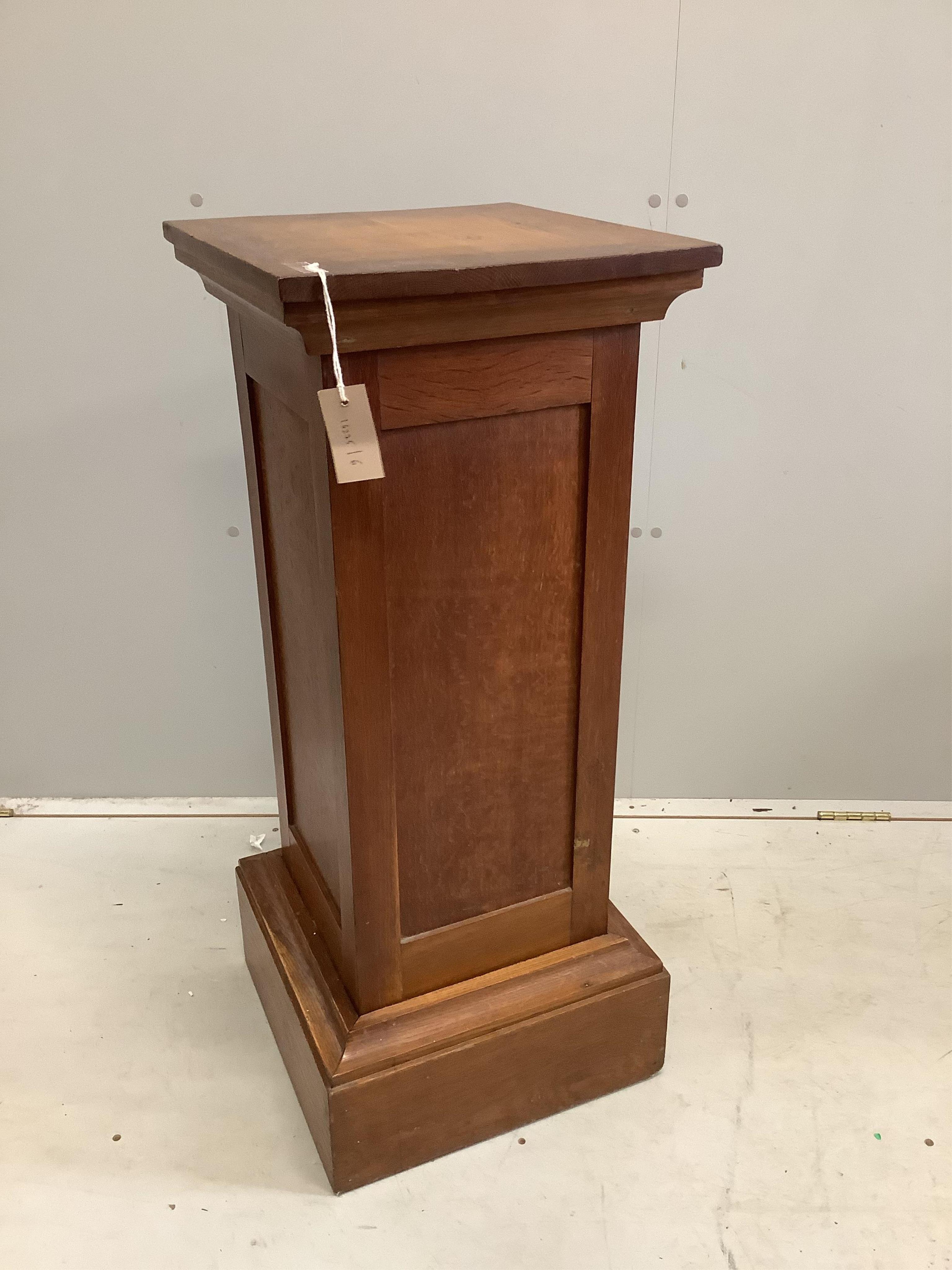 An early 20th century oak pedestal, width 37cm, height 90cm. Condition - fair